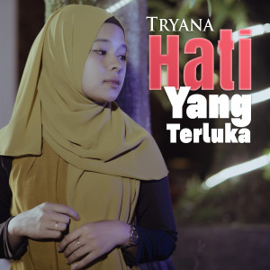Listen to Hati Yang Terluka song with lyrics from Tryana