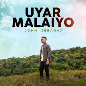 Dengarkan lagu Uyar Malaiyo nyanyian John Jebaraj dengan lirik