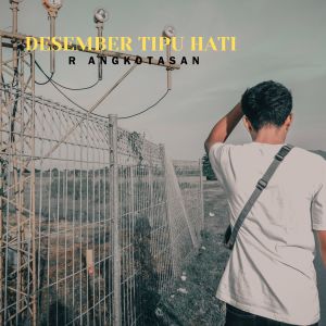 Album Desember Tipu Hati oleh R Angkotasan