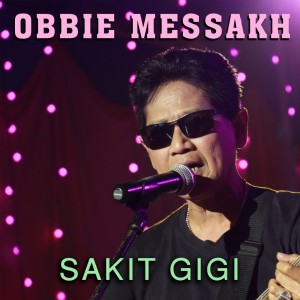 Dengarkan lagu Sakit Gigi nyanyian Obbie Mesakh dengan lirik