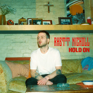 ดาวน์โหลดและฟังเพลง Hold On พร้อมเนื้อเพลงจาก Rhett Nicholl