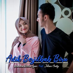Dengarkan lagu Adik Berjilbab Biru Feat. Jihan Audy nyanyian Wandra Restus1yan dengan lirik