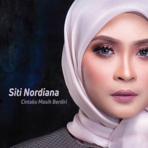 Dengarkan lagu Cintaku Masih Berdiri nyanyian Siti Nordiana dengan lirik