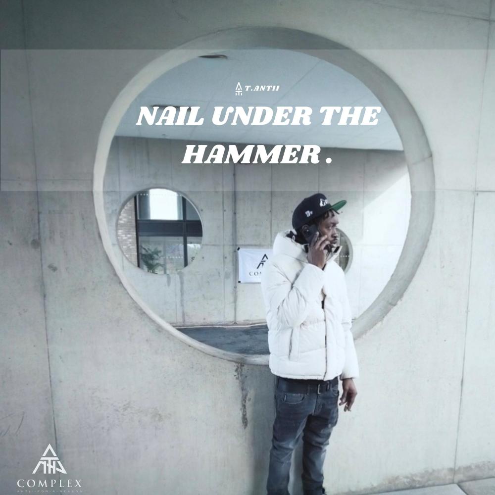 Nail under the hammer
