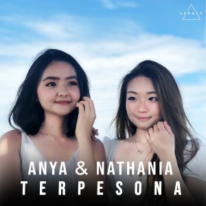 Dengarkan TERPESONA lagu dari Anya Anjani dengan lirik