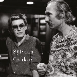 ดาวน์โหลดและฟังเพลง Flux (A Big, Bright, Colourful World) พร้อมเนื้อเพลงจาก Holger Czukay