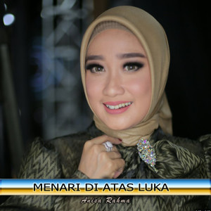Listen to Menari Diatas Luka song with lyrics from Anisa Rahma