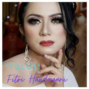 Listen to Tulus song with lyrics from Fitri Handayani
