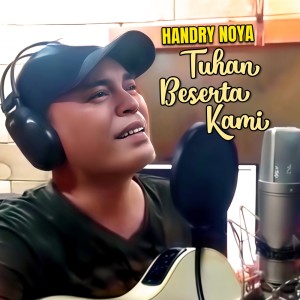 Listen to Tuhan Beserta Kami song with lyrics from Handry Noya
