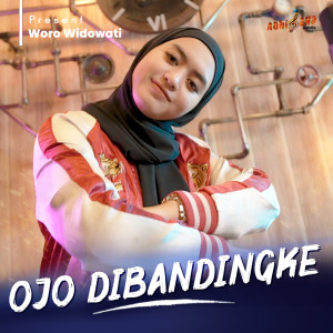 Listen to OJO DIBANDINGKE song with lyrics from Woro Widowati