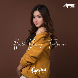 ดาวน์โหลดและฟังเพลง Hati Yang Terluka พร้อมเนื้อเพลงจาก Syafira Febrina