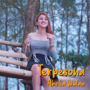 Listen to Terpesona song with lyrics from Abelia Wulan