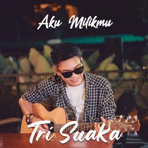 Dengarkan lagu Aku Milikmu nyanyian Tri Suaka dengan lirik