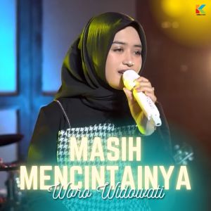Dengarkan Masih Mencintainya (Dangdut Version) lagu dari Woro Widowati dengan lirik