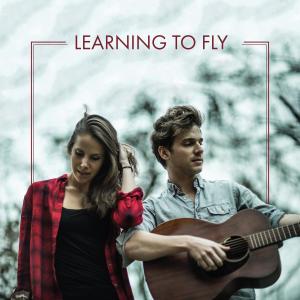 Listen to Learning to Fly song with lyrics from Colin & Caroline