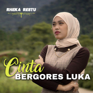 Listen to Cinta Bergores Luka song with lyrics from Rheka Restu