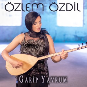 Listen to Garip Yavrum song with lyrics from Özlem Özdil