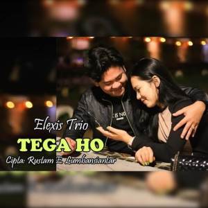 Dengarkan lagu Tega Ho nyanyian Elexis Trio dengan lirik