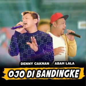 Dengarkan lagu Ojo Dibandingke nyanyian Denny Caknan dengan lirik