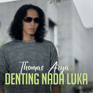 Dengarkan Denting Nada Luka lagu dari Thomas Arya dengan lirik
