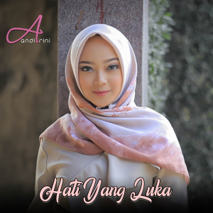 Listen to Hati Yang Luka song with lyrics from Andi Rini