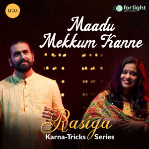 Listen to Maadu Mekkum Kanne (From "Rasiga Karna-Tricks Series") song with lyrics from Sudeep Palanad