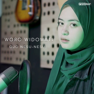 Dengarkan Ojo Nesu-Nesu lagu dari Woro Widowati dengan lirik