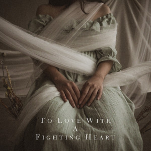 Dengarkan lagu To Love with a Fighting Heart nyanyian Natania Karin dengan lirik