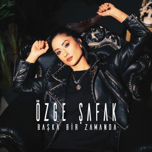Listen to Başka Bir Zamanda song with lyrics from Özge Şafak