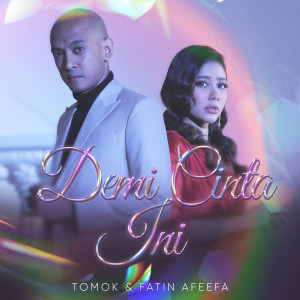 Dengarkan lagu Demi Cinta Ini nyanyian Tomok dengan lirik