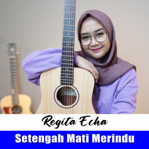 Listen to Setengah Mati Merindu song with lyrics from Regita Echa