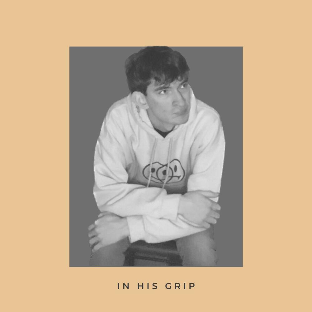 IN HIS GRIP