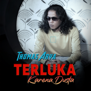 Dengarkan lagu Terluka Karena Dusta nyanyian Thomas Arya dengan lirik