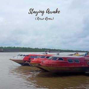 Dengarkan lagu Staying Awake (Xorro Remix) nyanyian Josh Tiong dengan lirik
