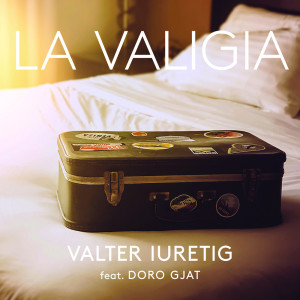 Dengarkan lagu La valigia nyanyian Valter Iuretig dengan lirik